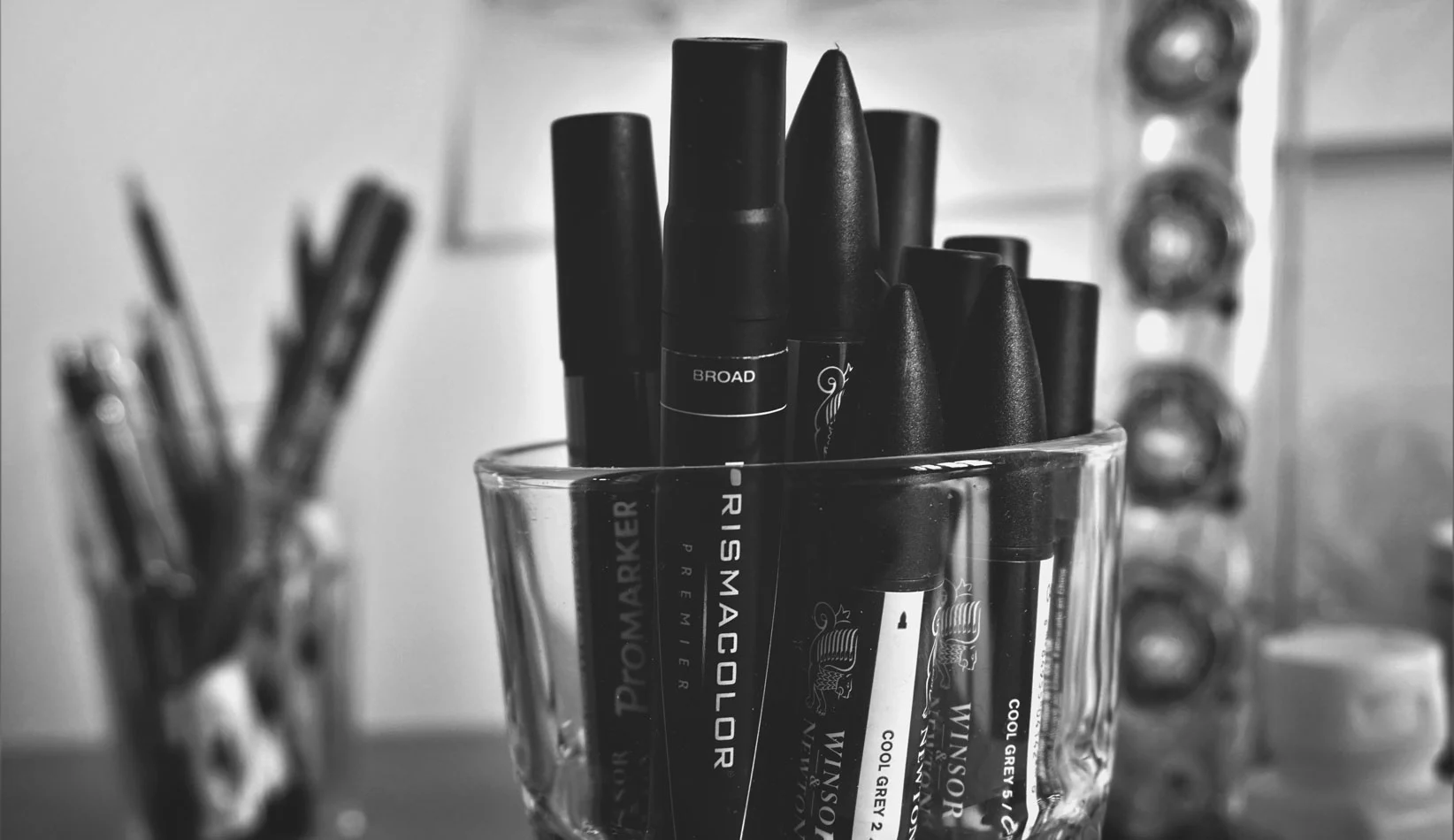 B&W photo of markers in a jar.